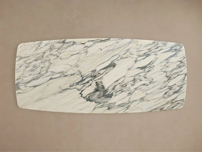 Front view of the Saint Germain Stone Dining Table with Toulouse Base, featuring a white marble top with grey veining and a dark brown wood base.