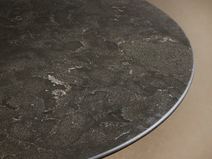 Front view of the Saint Germain Bar Table with a dark mottled stone round top and a fluted dark steel base.