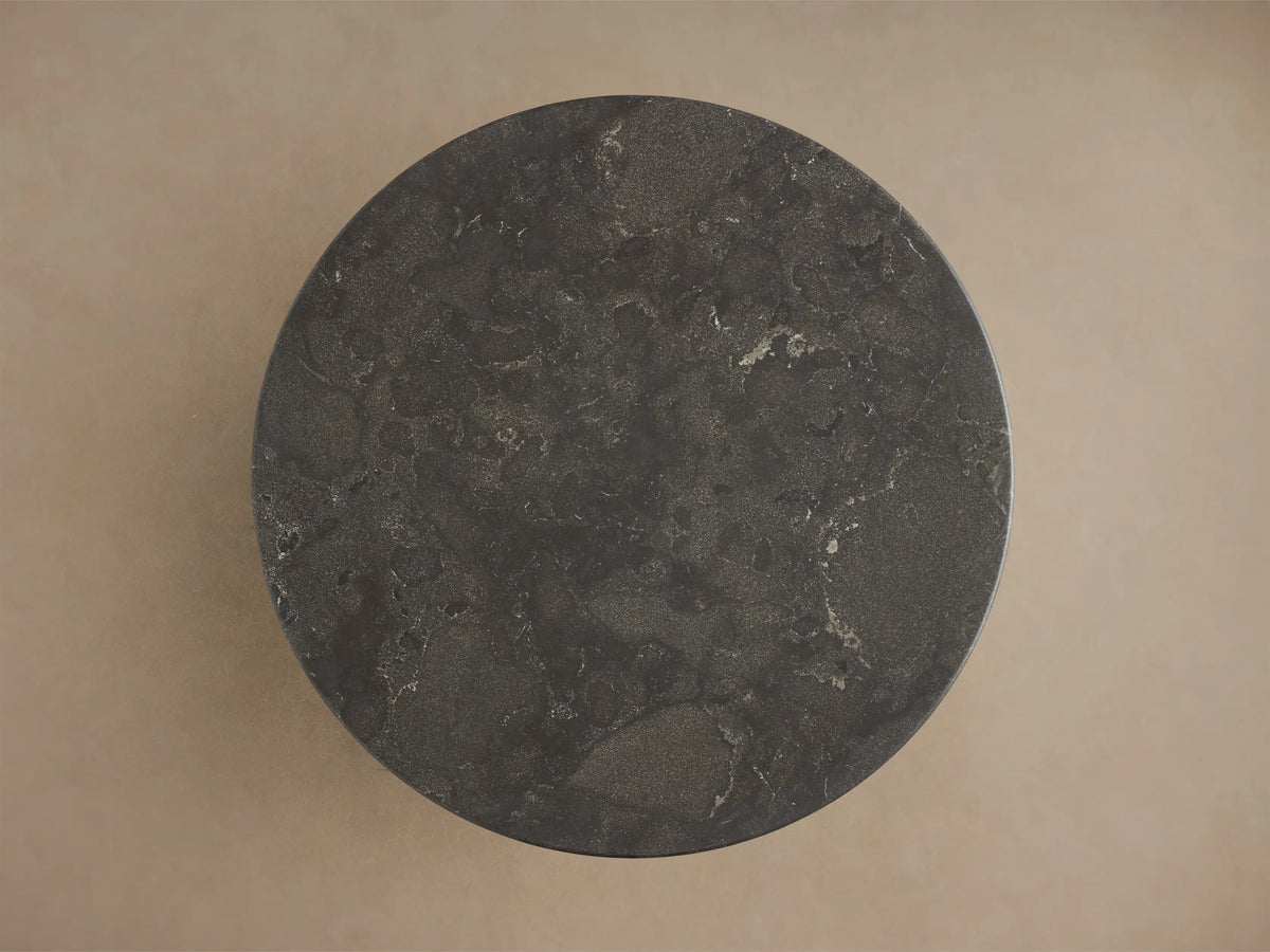 Close-up of the dark grey honed stone tabletop of the Saint Germain Bar Table, showing its textured surface with light veining.