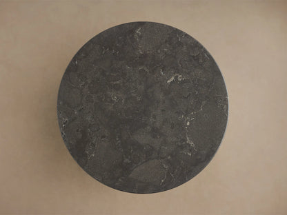 Close-up of the dark grey honed stone tabletop of the Saint Germain Bar Table, showing its textured surface with light veining.