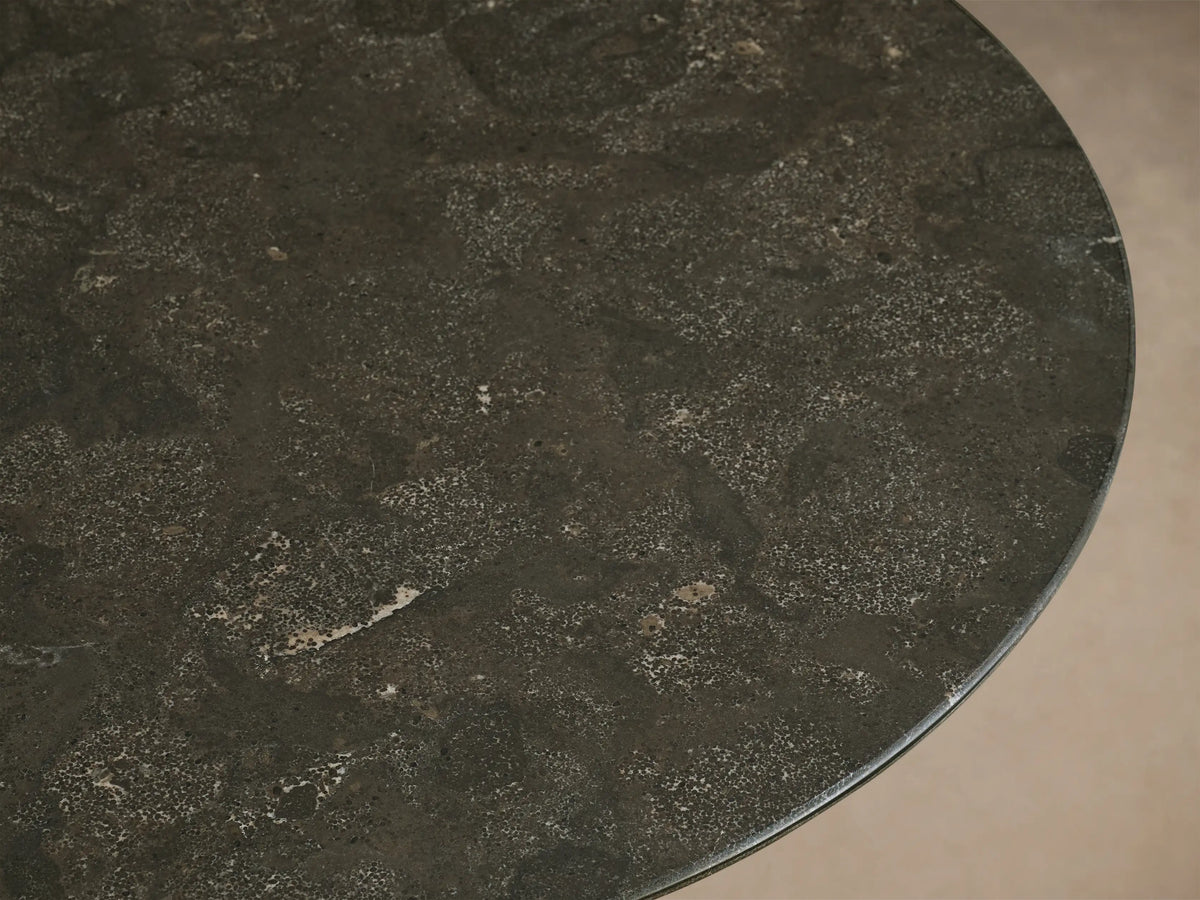 Close-up of the dark gray-green honed stone tabletop of the Saint Germain Counter Table, showing lighter natural variations.