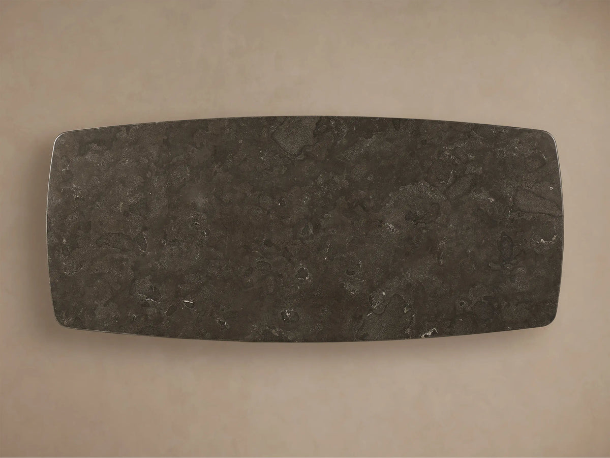 Front view of the dark gray Saint Germain Stone Dining Table with Toulouse Base, featuring a rectangular stone top and a thick dark wood base.