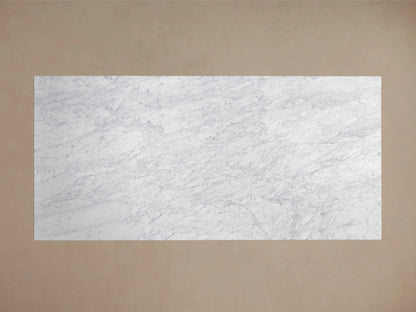 Front view of a rectangular white and gray veined marble table with a wide, tapered pedestal base.
