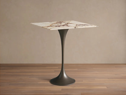 Front view of the Saint Germain Square Counter Table with a white marble top with brown veining and a dark flared steel base.