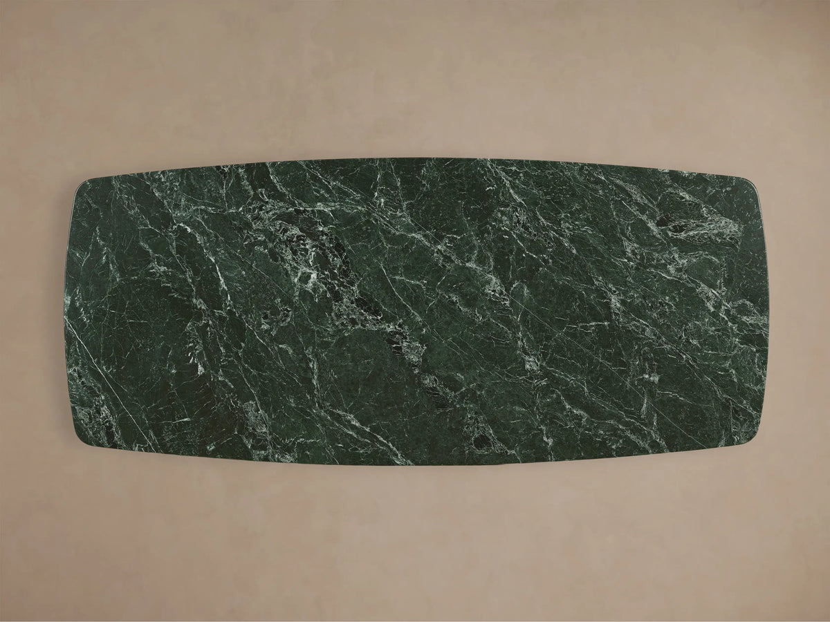 Front view of the dark green marble Saint Germain Stone Dining Table with Toulouse Base, featuring a light brown wooden base.
