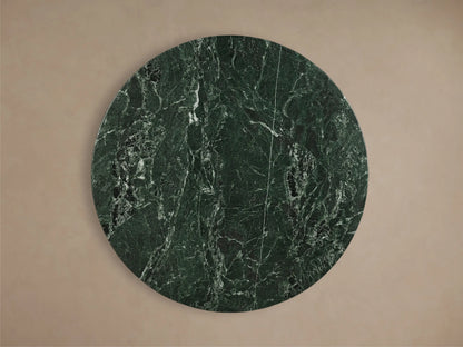 Front view of the dark green Saint Germain Round Stone Dining Table with Toulouse Base, featuring a black tapered wood base.