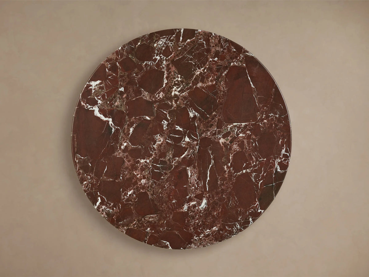 Front view of the Saint Germain Bar Table featuring a round reddish-brown marble top with white veining and a golden steel base.