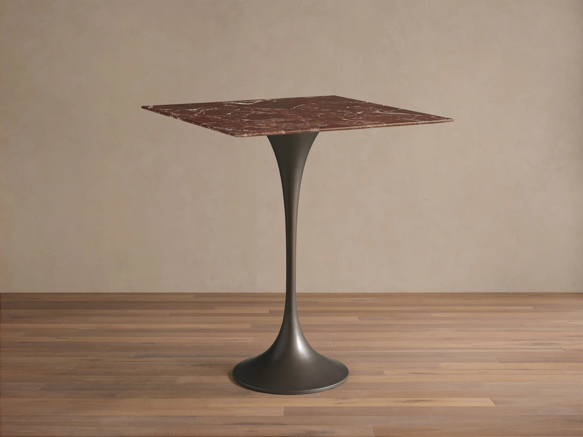 Front view of the Saint Germain Square Counter Table with a reddish-brown marble top and a dark grey steel trumpet base.