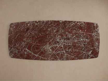 Front view of the Saint Germain Stone Dining Table with Toulouse Base, featuring a red marble top and a dark wood block base.