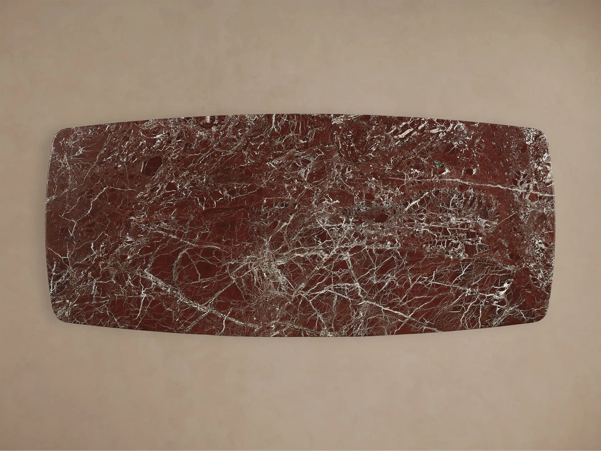 Front view of the Saint Germain Stone Dining Table with Toulouse Base, featuring a reddish-brown marble top and a black base.