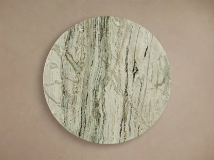 Front view of the Saint Germain Counter Table. It has a round light green honed stone top with natural veining and a dark gray steel flared base.