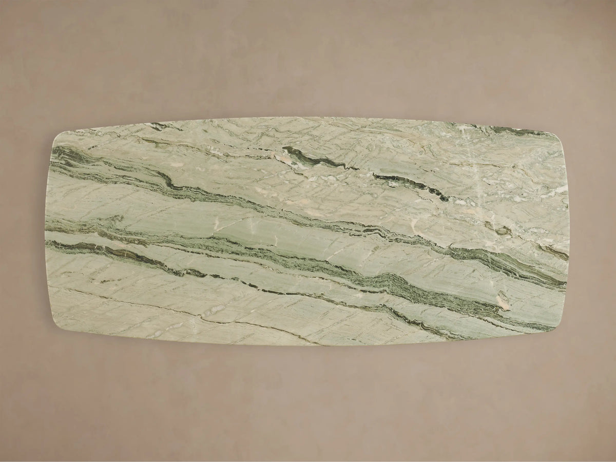 Front view of the Saint Germain Stone Dining Table with Toulouse Base, featuring a green veined stone top and a dark block base.