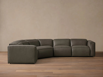Front view of the dark grey Coburn Motion Leather Four-Piece Corner Wedge Sectional with visible stitching.