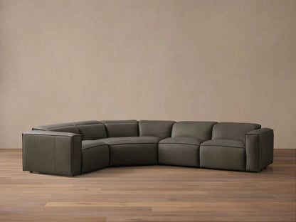 Front view of the dark grey Coburn Motion Leather Four-Piece Corner Wedge Sectional with visible stitching.
