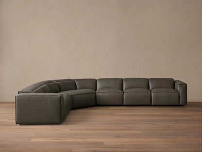 Front view of the dark grey leather Coburn Motion Leather Six-Piece Corner Wedge Sectional with defined stitching.