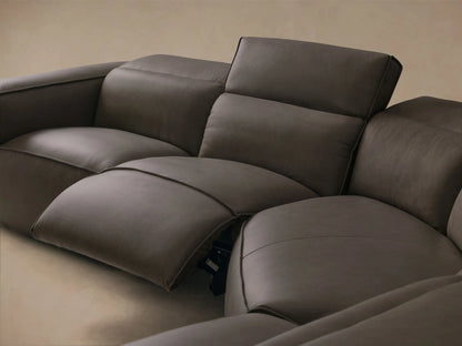 Front view of the dark grey Coburn Motion Leather Six-Piece Corner Wedge Sectional with plush cushions and contrasting piping.