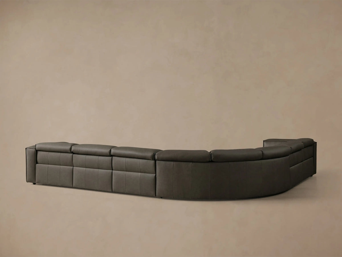 Close-up of the grey textured leather on the Coburn Motion Leather Six-Piece Corner Wedge Sectional, showing the metallic grey motion control panel with black buttons.