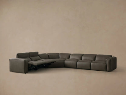 Rear view of the dark gray leather Coburn Motion Leather Six-Piece Corner Wedge Sectional, showing its curved back and panel details.