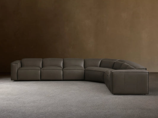 Front view of the dark grey leather Coburn Motion Leather Six-Piece Corner Wedge Sectional with defined stitching.
