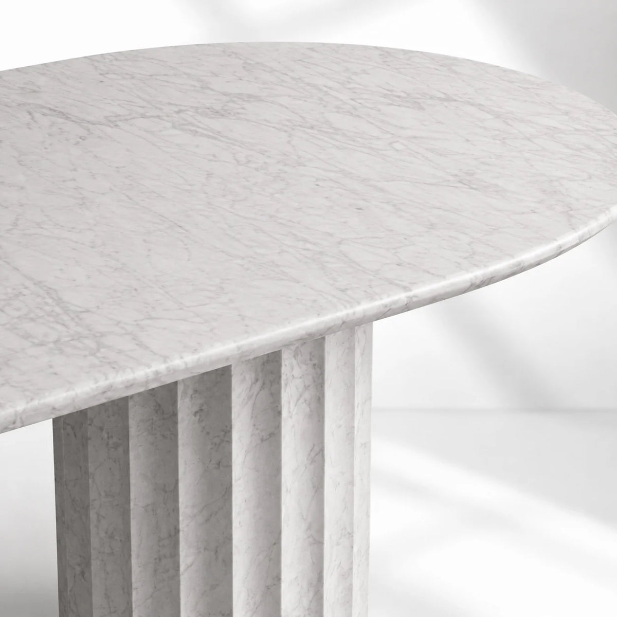 Danae Oval Marble Dining Table with Fluted Pedestal Base