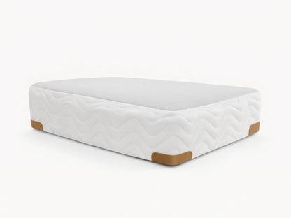 Premium Box Spring with white zigzag patterned fabric, featuring brass-finished metal corner guards on a wooden floor.
