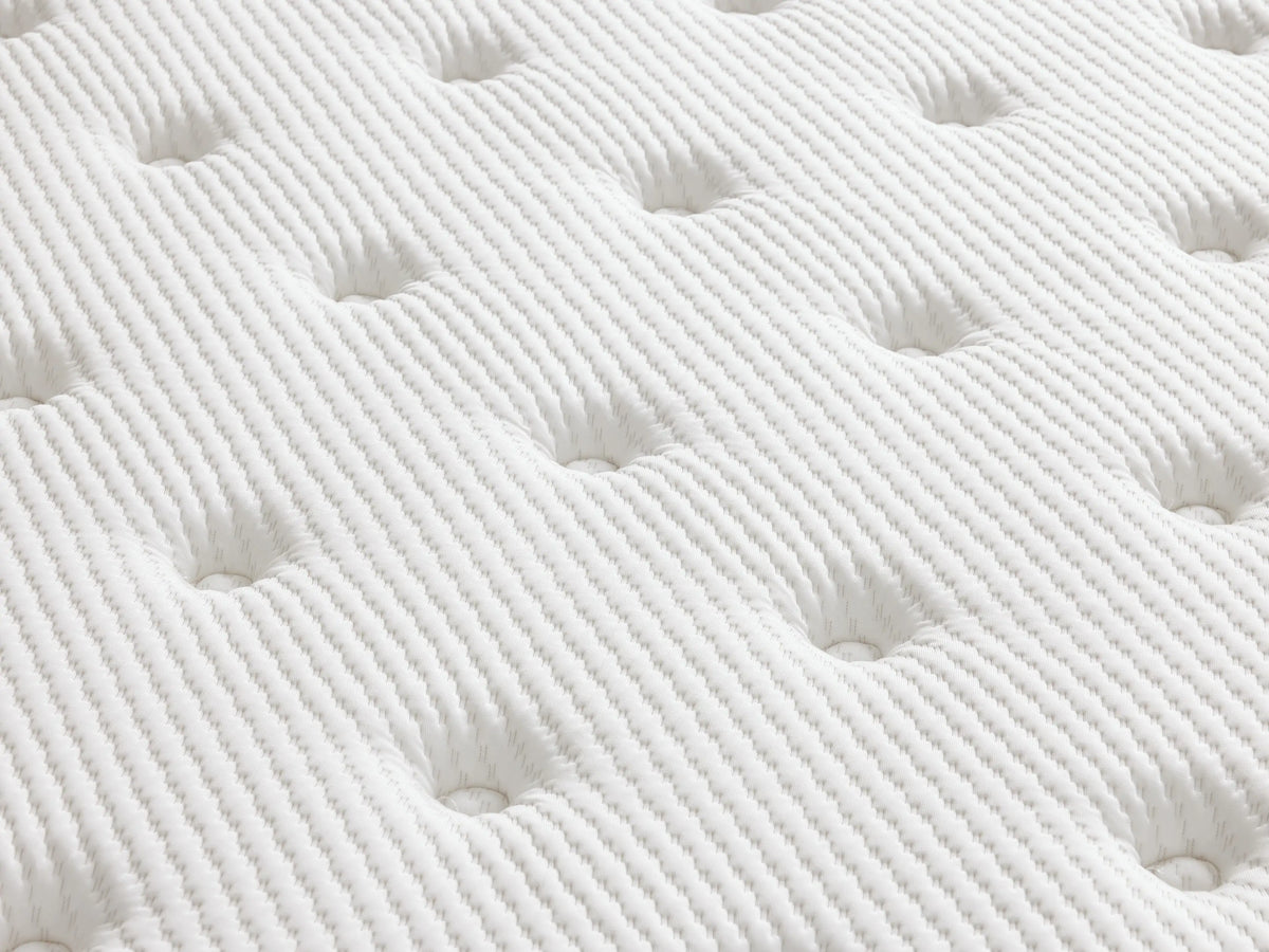 Plush mattress with a soft, quilted cotton cover, featuring visible stitching and "Zarevium" branding. Placed on a light wooden bed frame with a beige headboard, in a neutral setting.