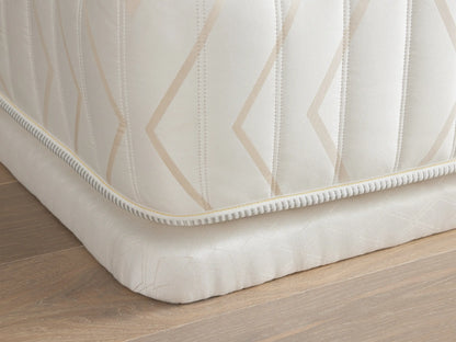 Luxury 2” Platform with a geometric pattern on white fabric, angled view showing the upholstered corner on a wooden floor.