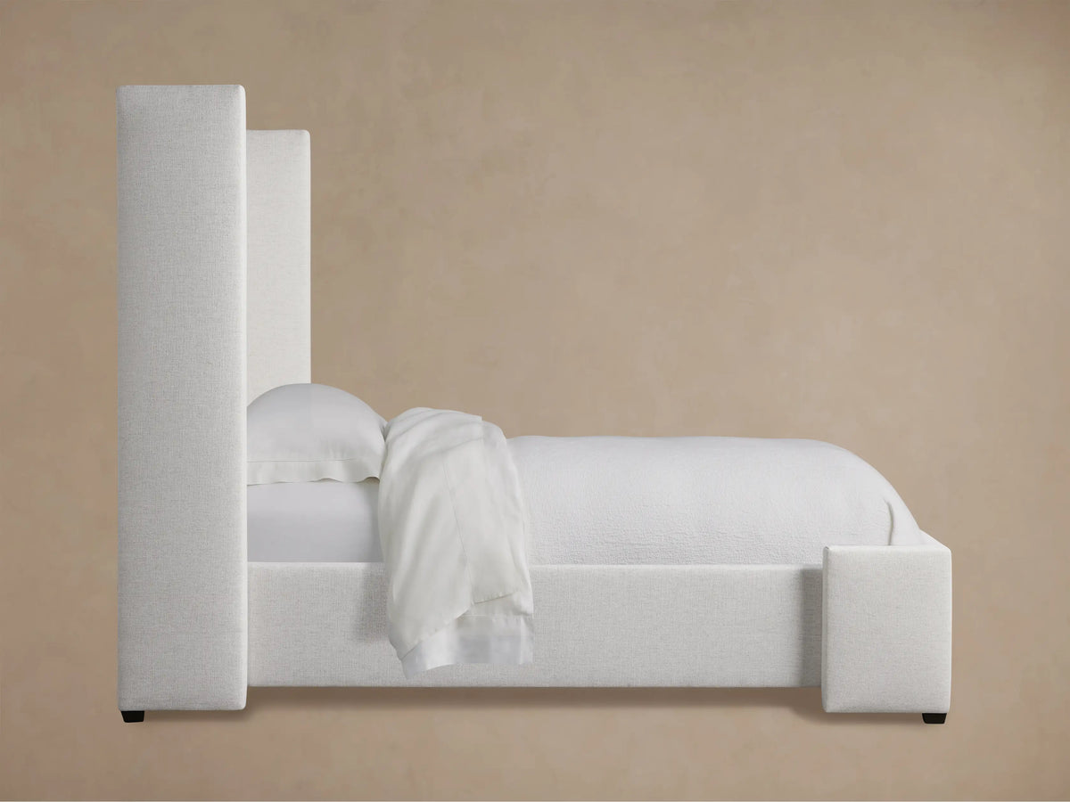 Close-up of Wyller Box-Tufted Twin Bed headboard in light gray textured fabric with visible box-tufting and a side wing.