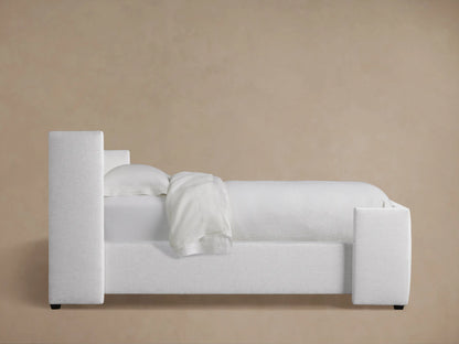 Close-up of Wyller Box-Tufted Twin Bed headboard, light gray textured fabric with visible box-tufting details.