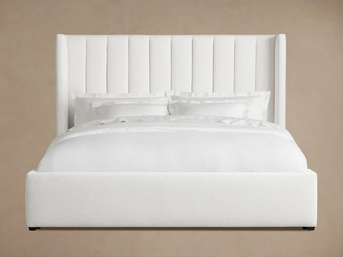 Wyller Channel-Stitched Bed, white, with tall vertical channel-stitched headboard, low footboard, on wood floor.