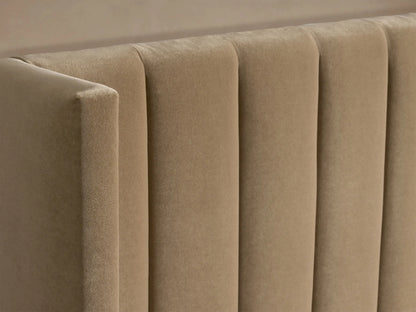 Wyller Channel-Stitched Bed with Low Footboard. Tan upholstered headboard with vertical channels, white bedding.