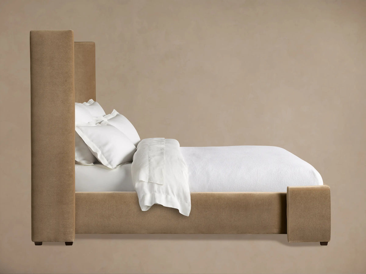 Close-up of Wyller Channel-Stitched Bed's light brown plush headboard, featuring vertical channel-stitching and an upholstered edge.
