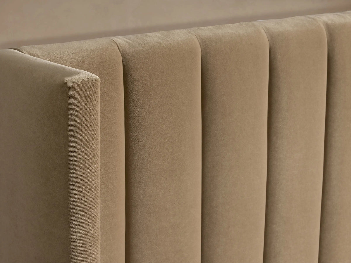 Beige Wyller Channel-Stitched Bed with Low Footboard, front view. Features channel-stitched headboard & white bedding.