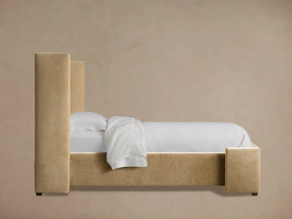 Close-up of Wyller Twin Bed headboard. Plush light brown fabric with prominent vertical channel-stitched detailing.