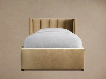 Wyller Channel-Stitched Twin Bed, beige upholstered, with vertical channel tufting on the headboard and white bedding.