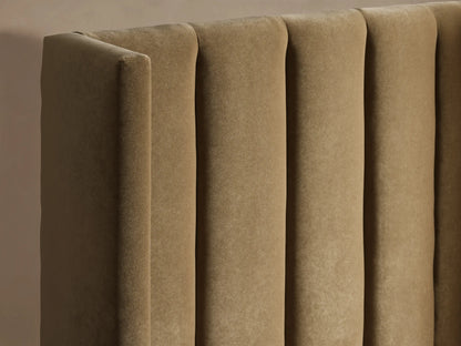 Front view of a Wyller Channel-Stitched Twin Bed upholstered in light tan fabric with a vertically stitched headboard and white bedding.