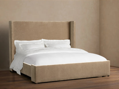 Wyller Bed with a tall, light brown upholstered wingback headboard and matching frame, dressed with crisp white bedding.