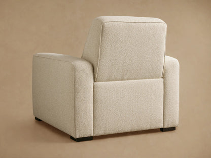 Close-up of the Cream textured fabric on the Borough Motion Recliner, showing the armrest, seat, and channel-tufted back.