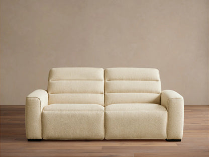 Front view of the cream Borough Two-Piece Motion Sofa, a two-seater with horizontally stitched back cushions and wide armrests.