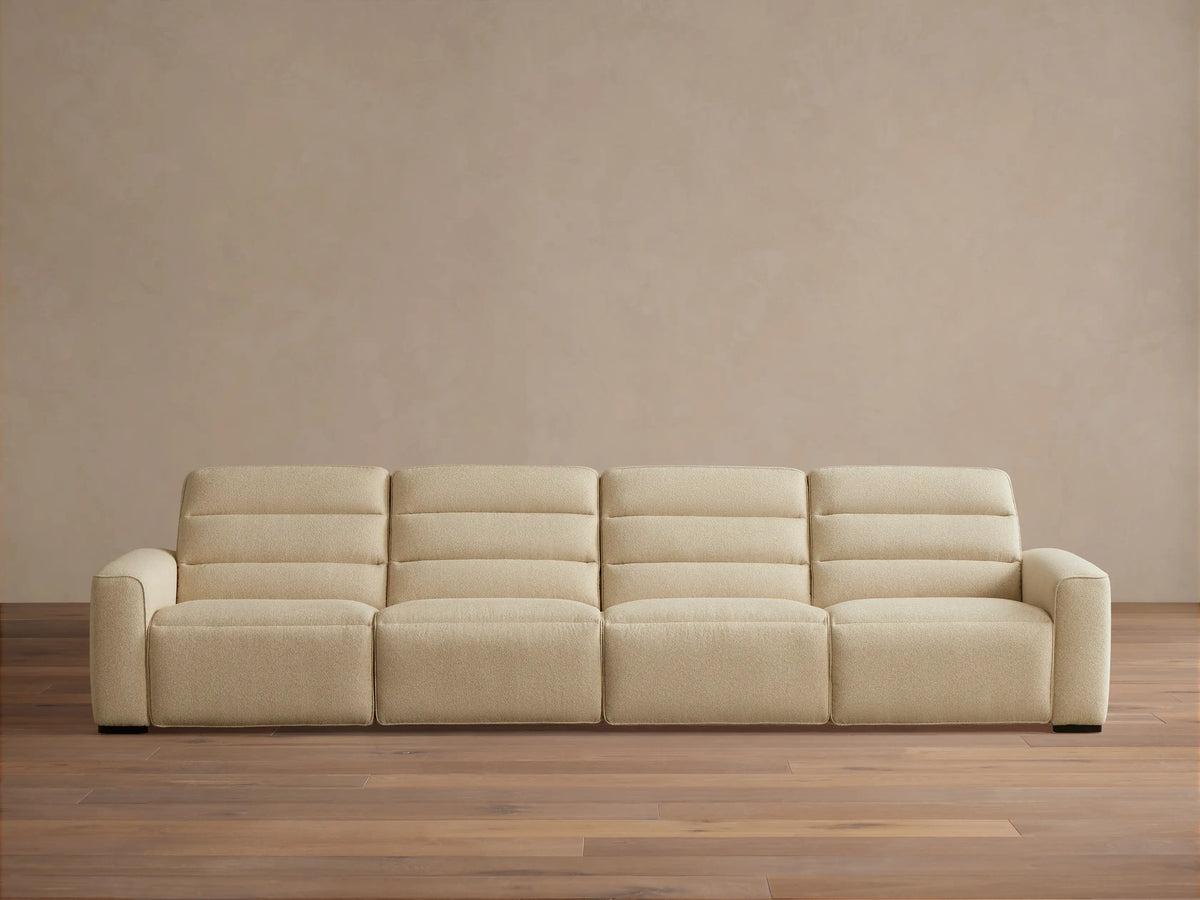 Front view of the cream Borough Four-Piece Motion Sectional with horizontally stitched backrests.