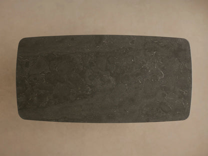 Front view of the dark grey Saint Germain Stone Coffee Table with black Rennes oak bases.