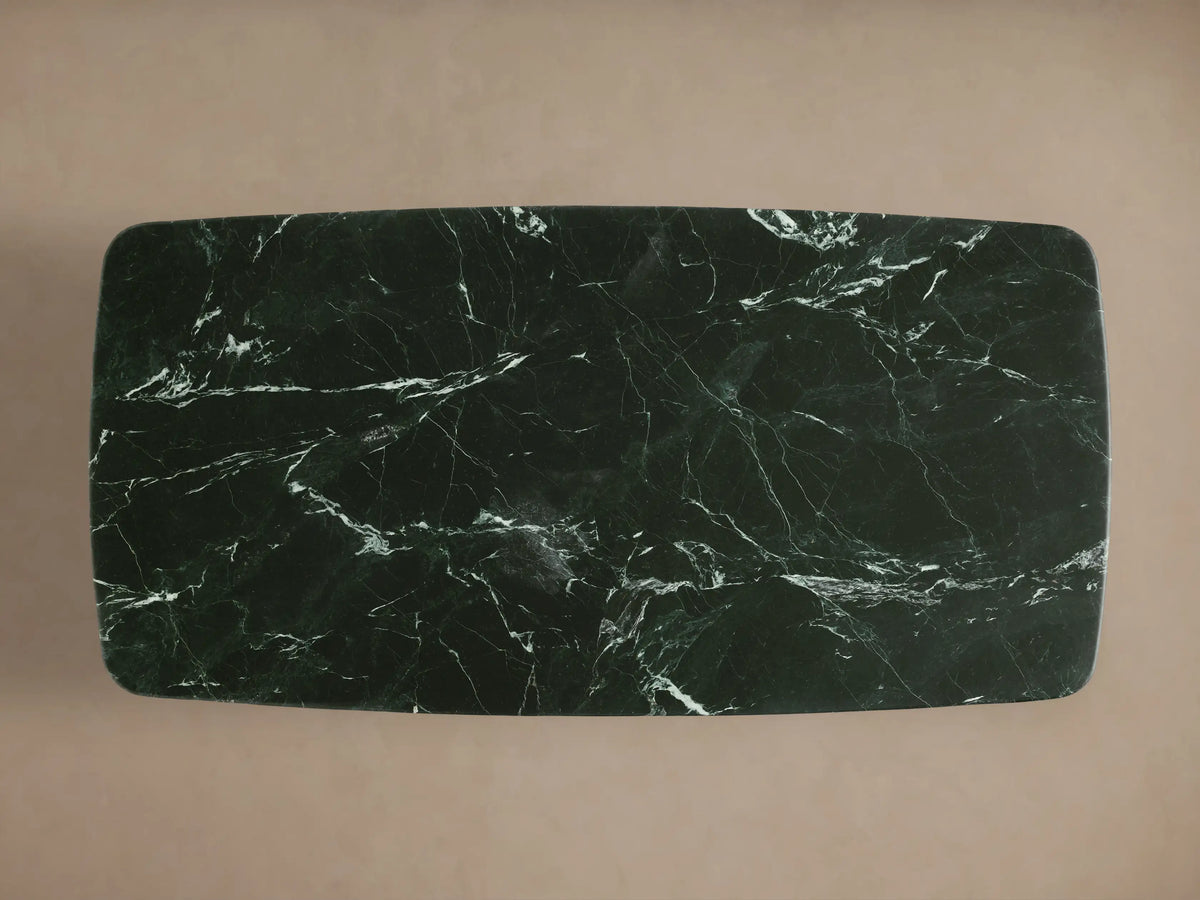 Front view of the Saint Germain Stone Coffee Table with Dauphine Base. Dark green stone top with white veining, black oak bases.