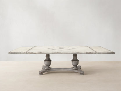Biancca Bell'Arte rectangular dining table with distressed Antique White top, Antique Grey floral scroll, and pedestal base.