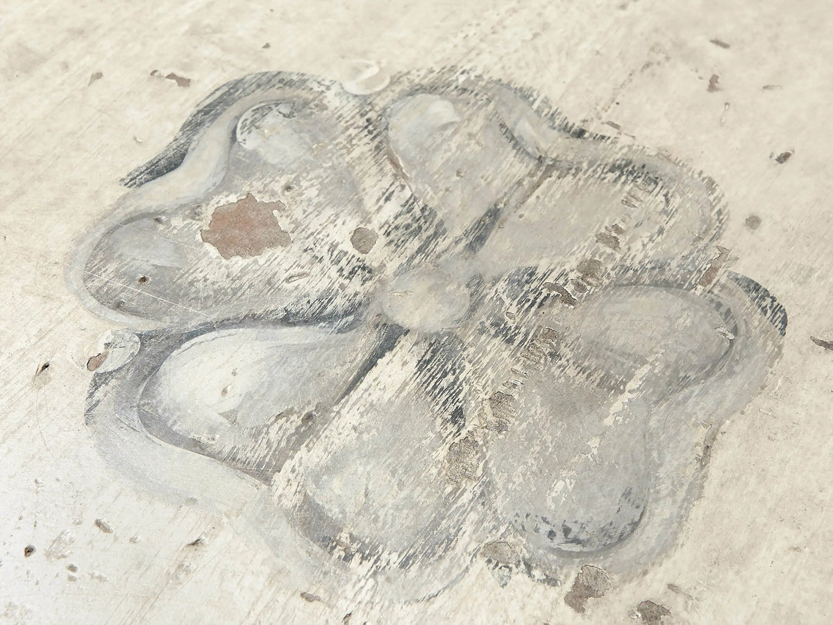 Round Biancca Bell‚ÄôArte dining table top, antique white distressed finish, gray floral scroll design, top-down view.
