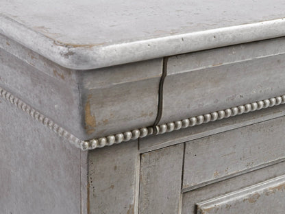 Giada Bell'Arte Console, a distressed antique grey cabinet with sliding panel doors, ornate top trim, and a decorative base.