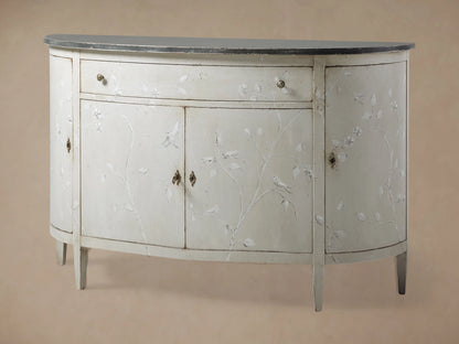Sofia Bell'Arte Demilune Cabinet with a curved design, white finish, delicate bird motifs, and a dark top. Features one drawer and two doors.
