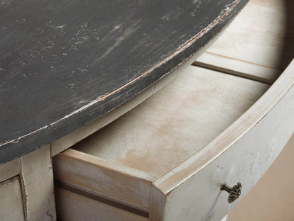 Sofia Bell'Arte Demilune Cabinet with curved design, hand-painted floral motifs, distressed antique white finish, and dark top.