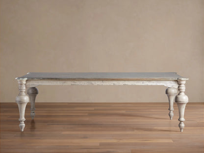 Alessia Bell'Arte Dining Table with distressed ivory, grey & beige base, ornate hand-carved legs, and a dark grey top on wood.