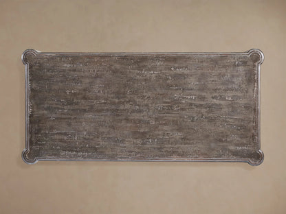 Alessia Bell'Arte Dining Table with distressed ivory, grey & beige base, ornate hand-carved legs, and a dark grey top on wood.