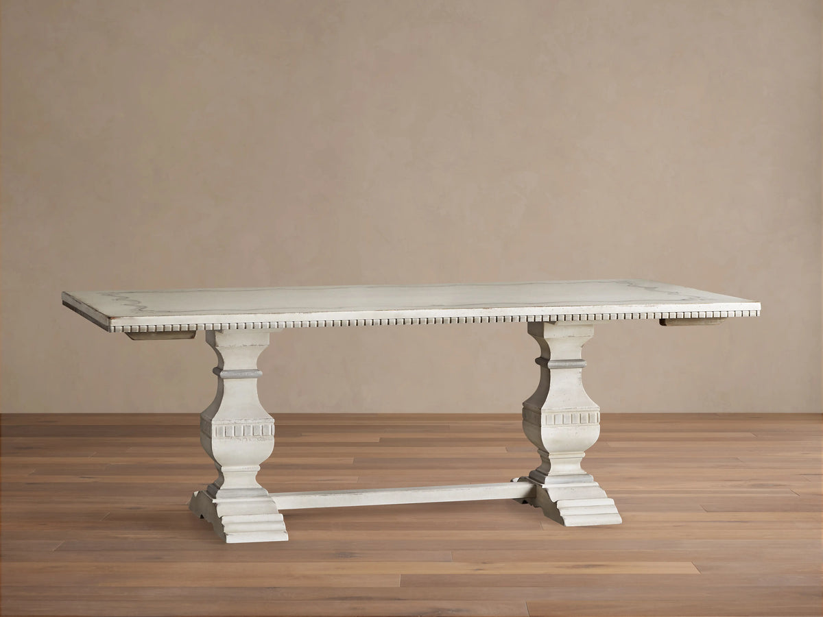 Cerea Ribbon Bell'Arte Dining Table. Distressed off-white wood, rectangular top with hand-painted ribbon border, two pedestal bases.